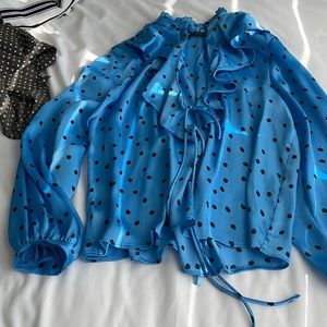 Sky blue silky long sleeve top with black Polk dots and ruffle front